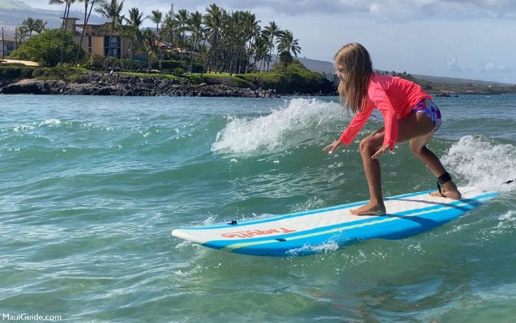 Young girl surfing.