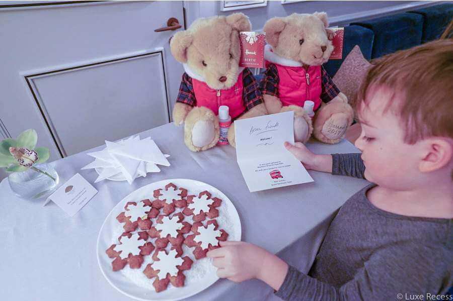 Child with a plate of cookies.