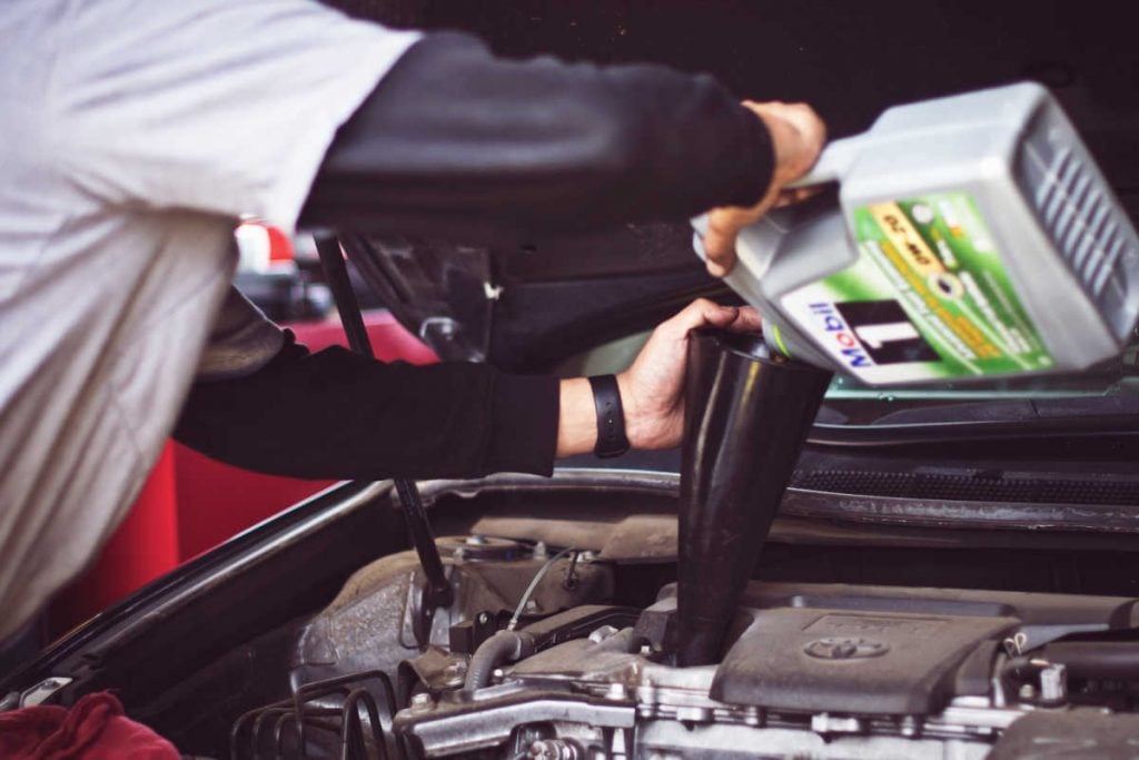 Filling oil car before road trip