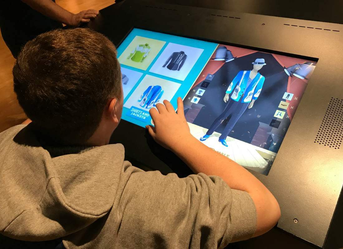Boy using interactive display at Country Music Hall of Fame.