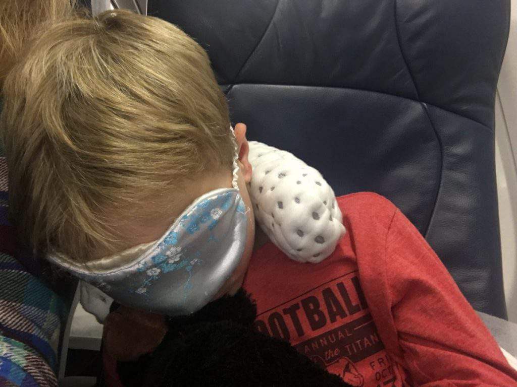 carry on bag essentials travel pillow eye mask-kids are a trip