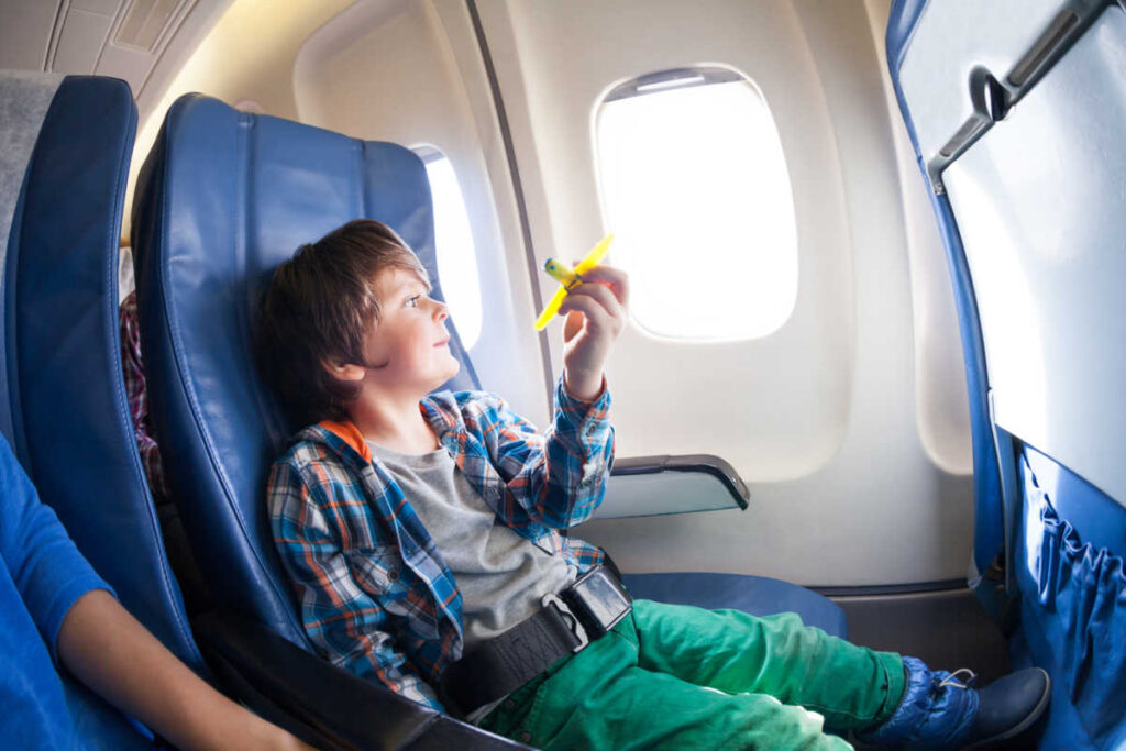 Kid flying on the plane